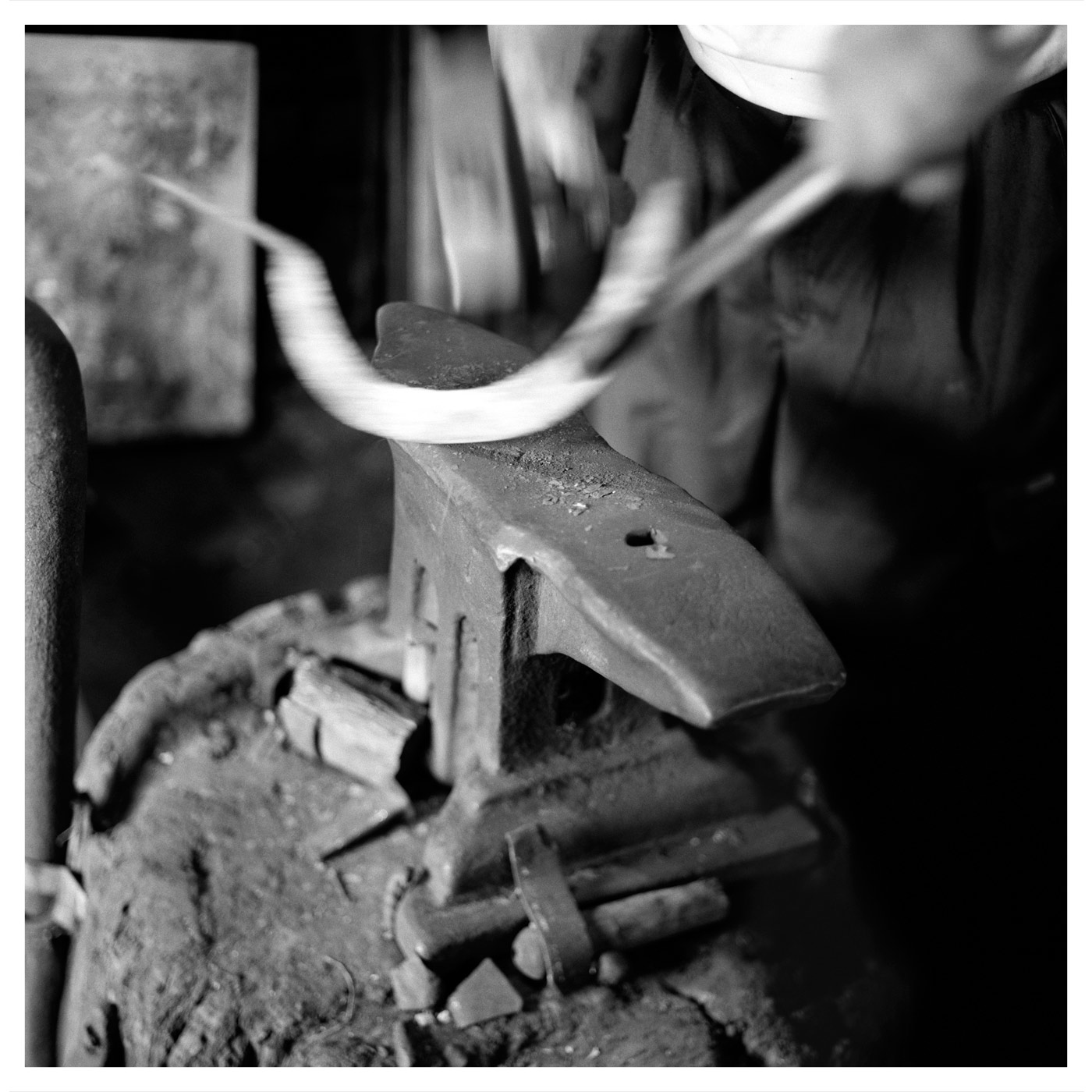 Blacksmith (hammering sickle). Ochojno, Poland, July 2009, Allan Sekula